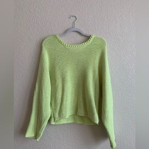 Bright pastel yellow sweater, thick but airy, flattering length